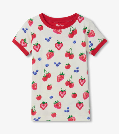 Girls cream cotton short-sleeve pajama top with red trim and colorful berry print, front view