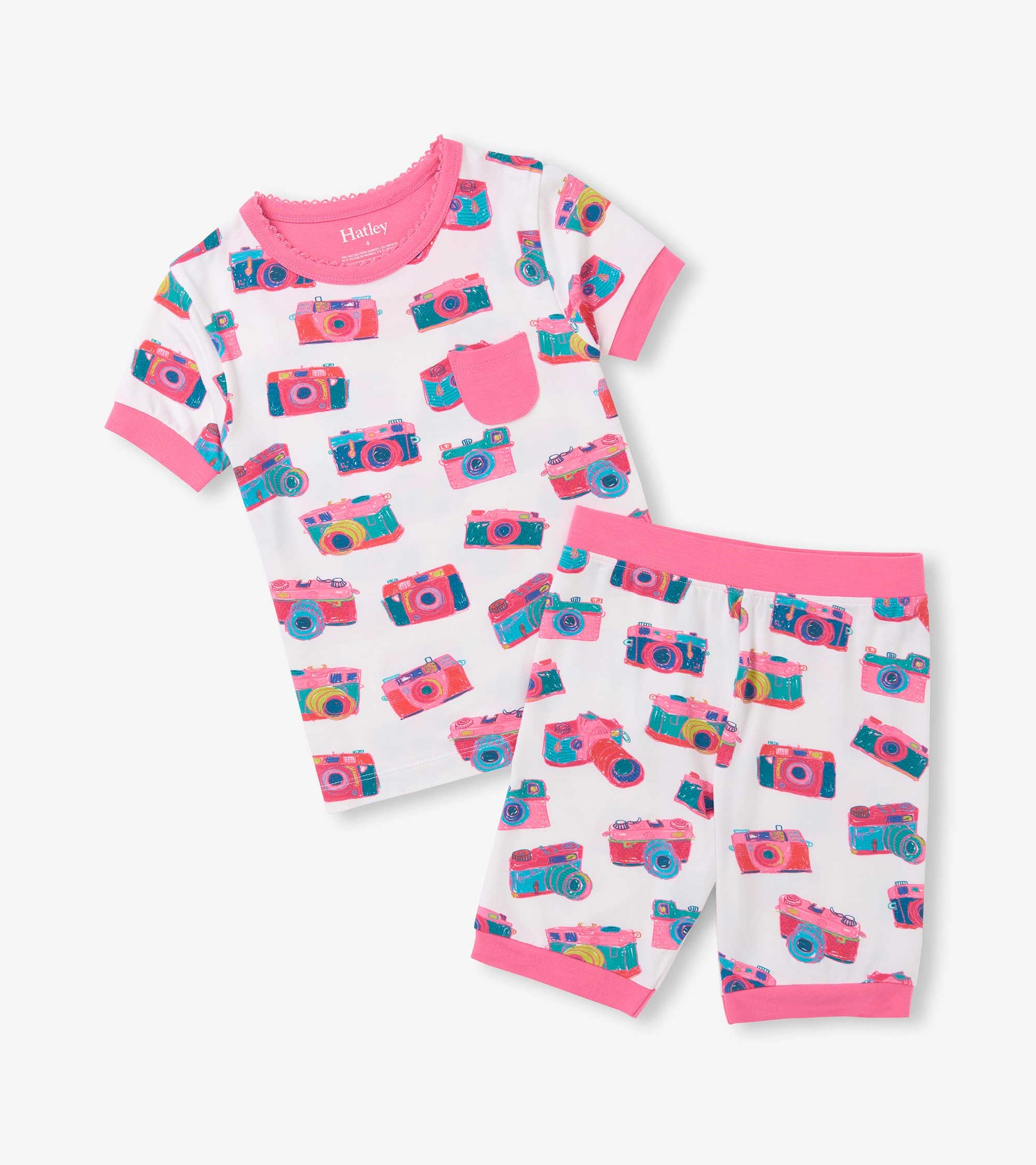 White girls short pajama set with pink trim, chest pocket, and colorful camera print