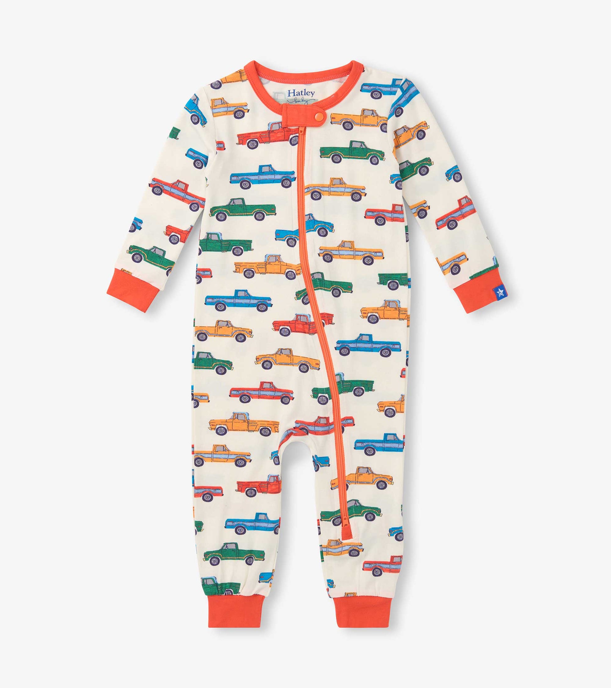 Cream baby sleeper with colorful truck print, orange trim, front zipper, and long sleeves