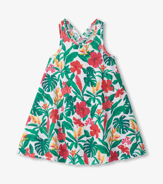 Girls white trapeze dress with green and red tropical floral print, sleeveless front view