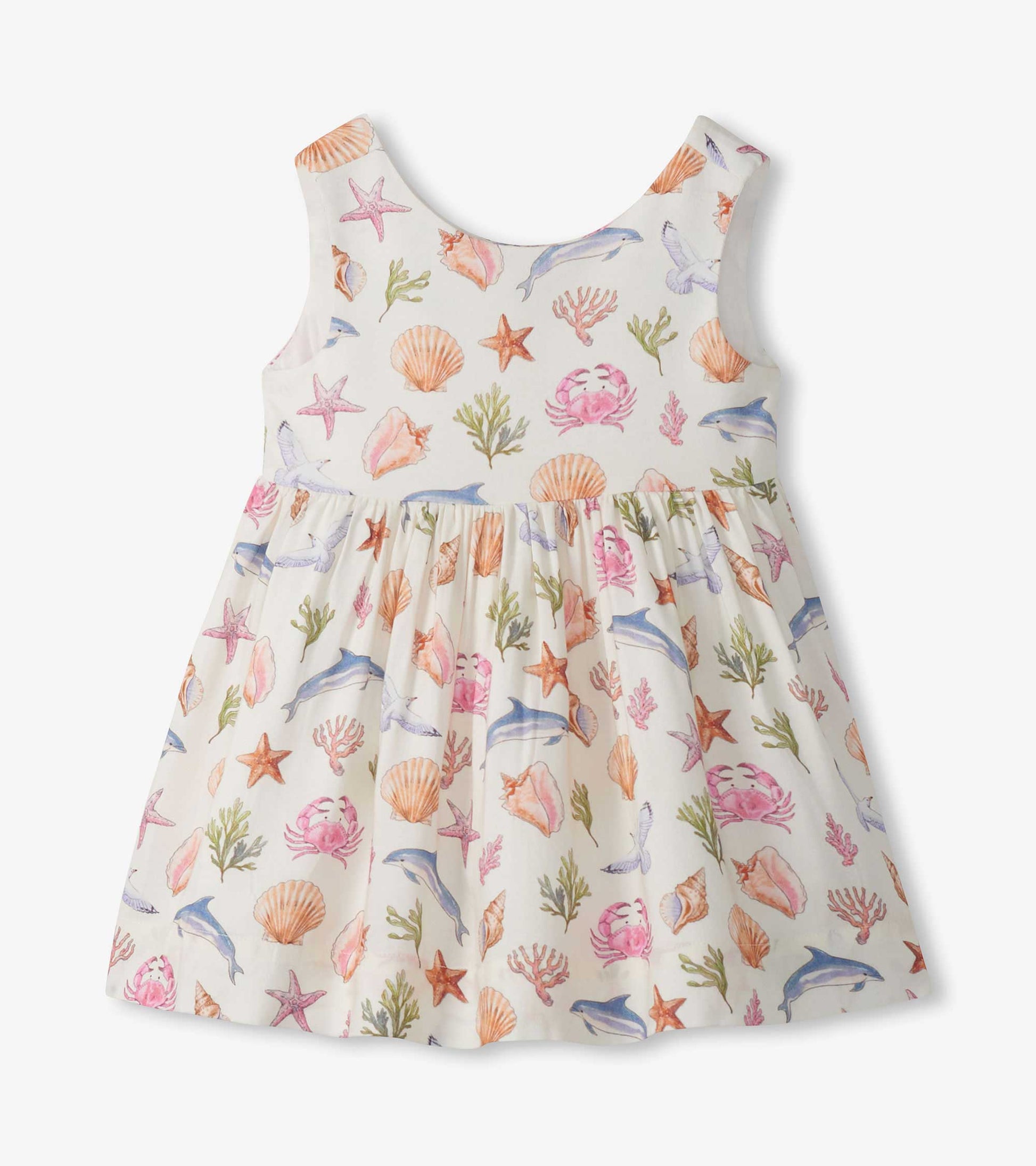 Sleeveless white toddler dress with pastel sea life print and gathered skirt, front view