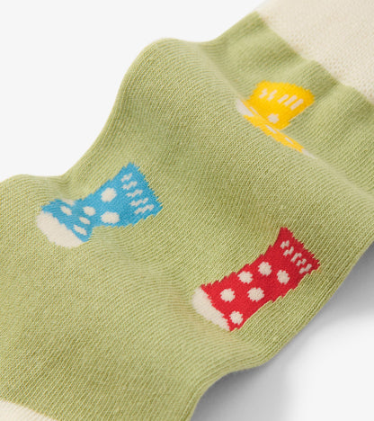 Green crew socks featuring colorful boot patterns in blue, red, and yellow with white polka dots.