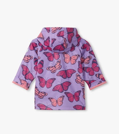 Purple hooded girls raincoat with pink and red butterfly print, front view