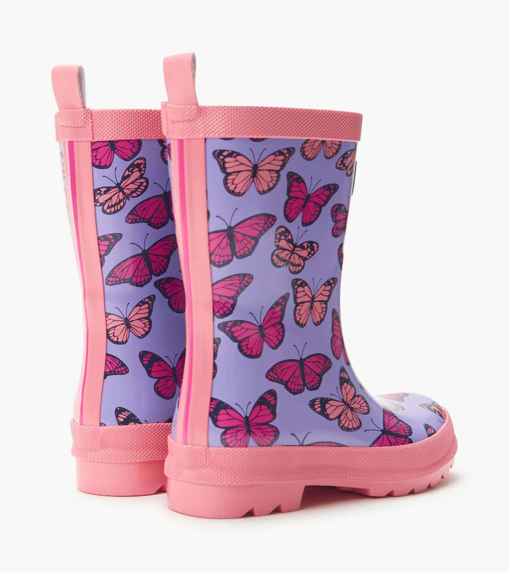 Girls purple rain boots with pink butterfly print and pink trim, shown in side view