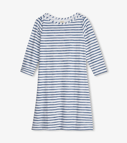 White dress with navy watercolor stripes, 3/4 sleeves, and a relaxed fit, suitable for summer wear.