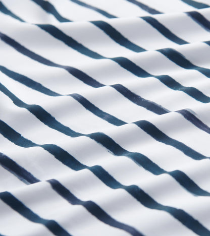 White fabric featuring watercolor stripes in navy blue, suitable for a 3/4 sleeve summer dress.