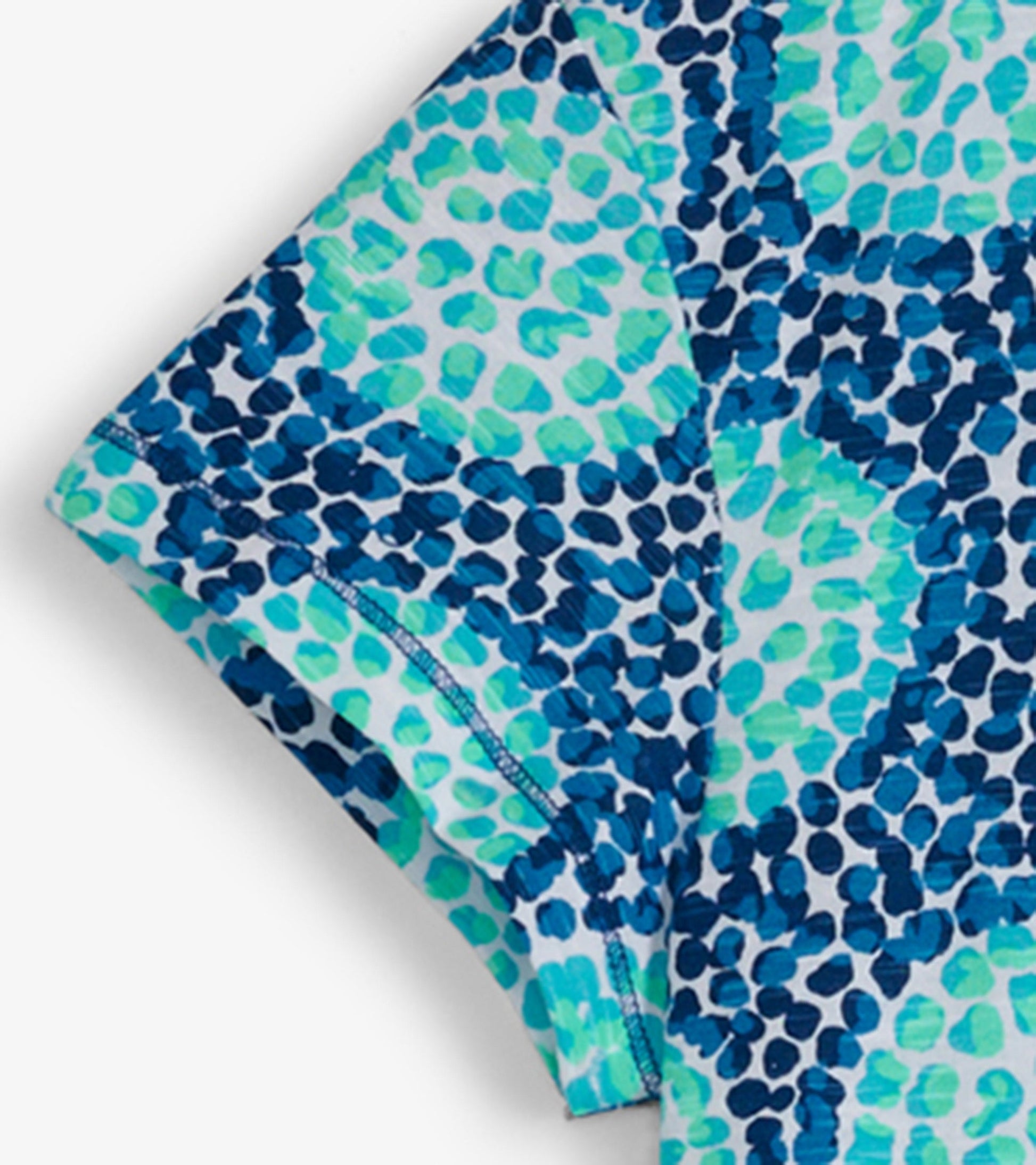 Crew neck t-shirt dress featuring a vibrant blue and green abstract pattern, made from lightweight fabric.