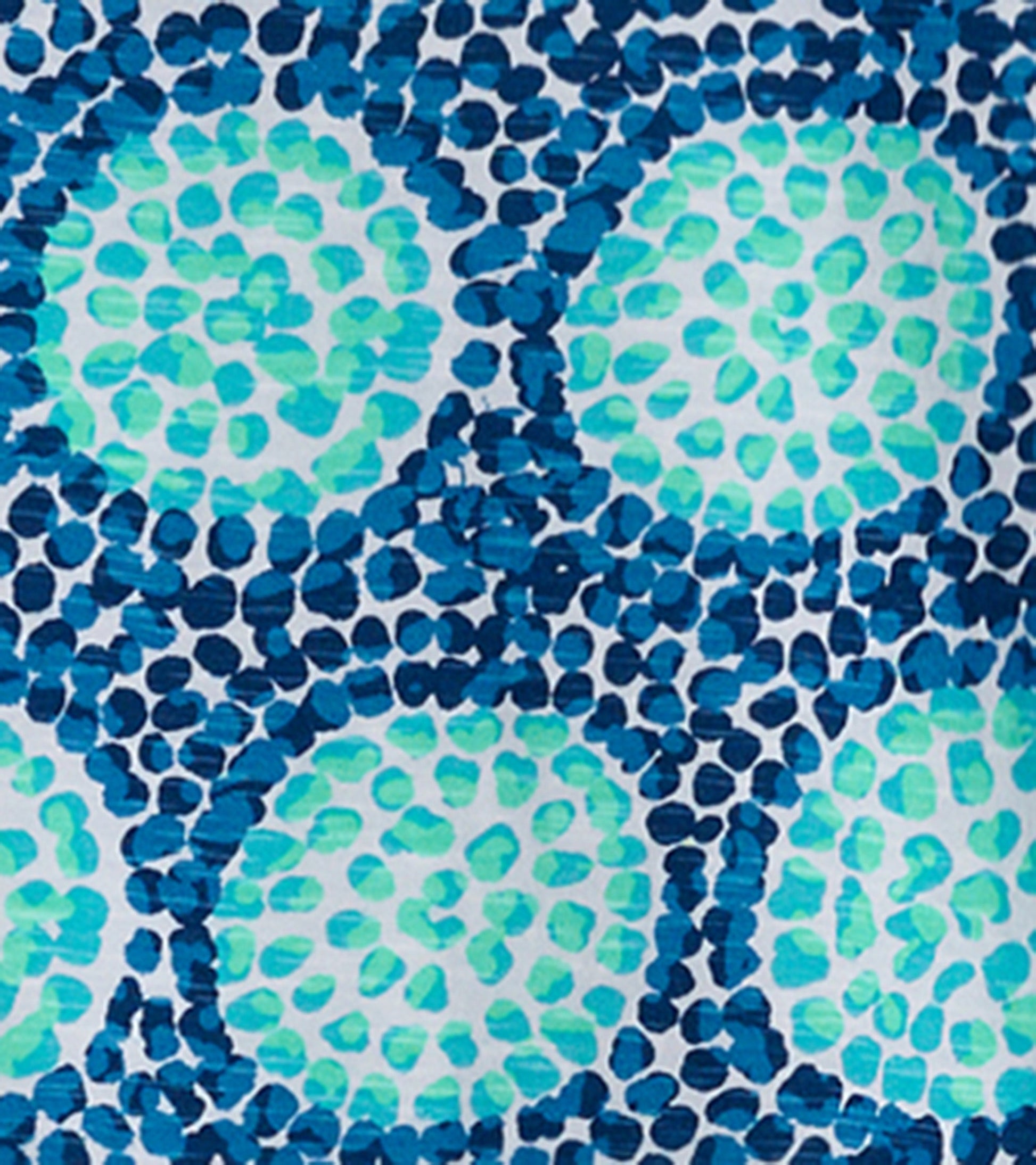 Patterned fabric featuring blue and green circular designs on a white background. Suitable for casual wear.