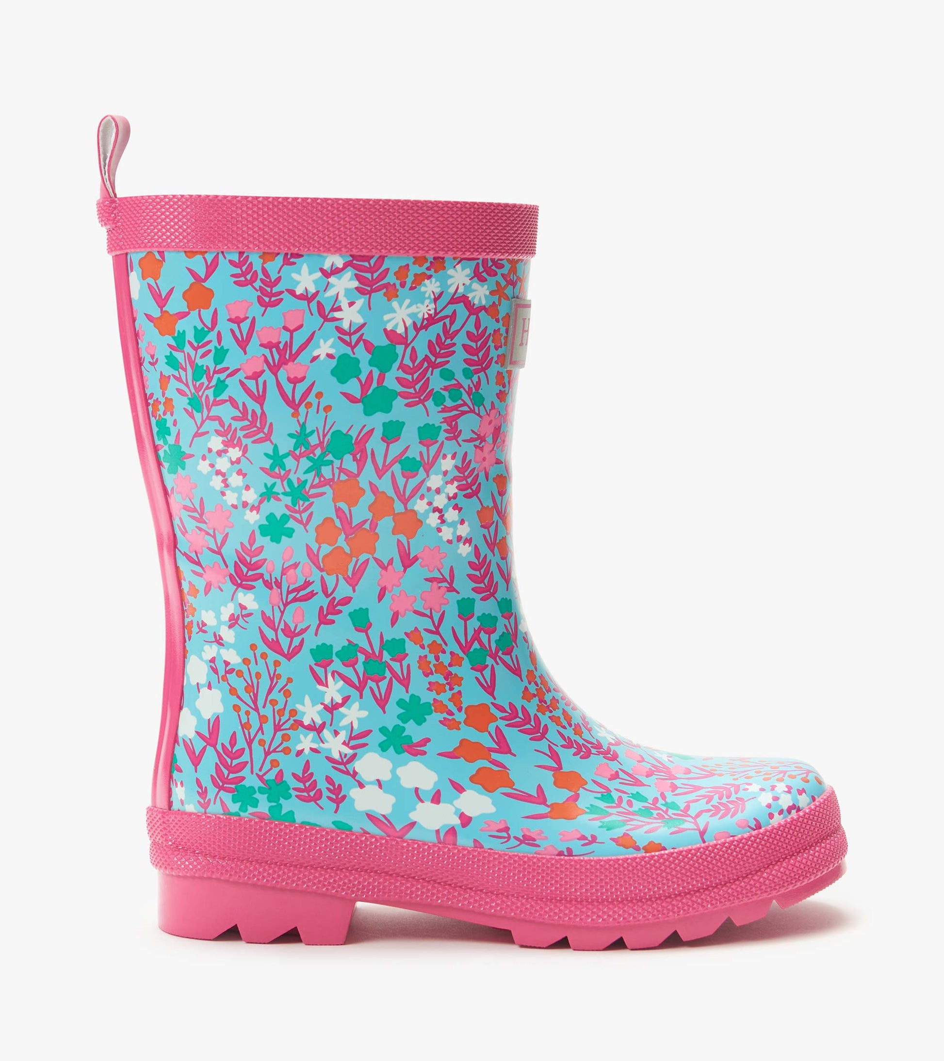 Kids pink and blue floral print rain boot with textured sole and pull tab, side view