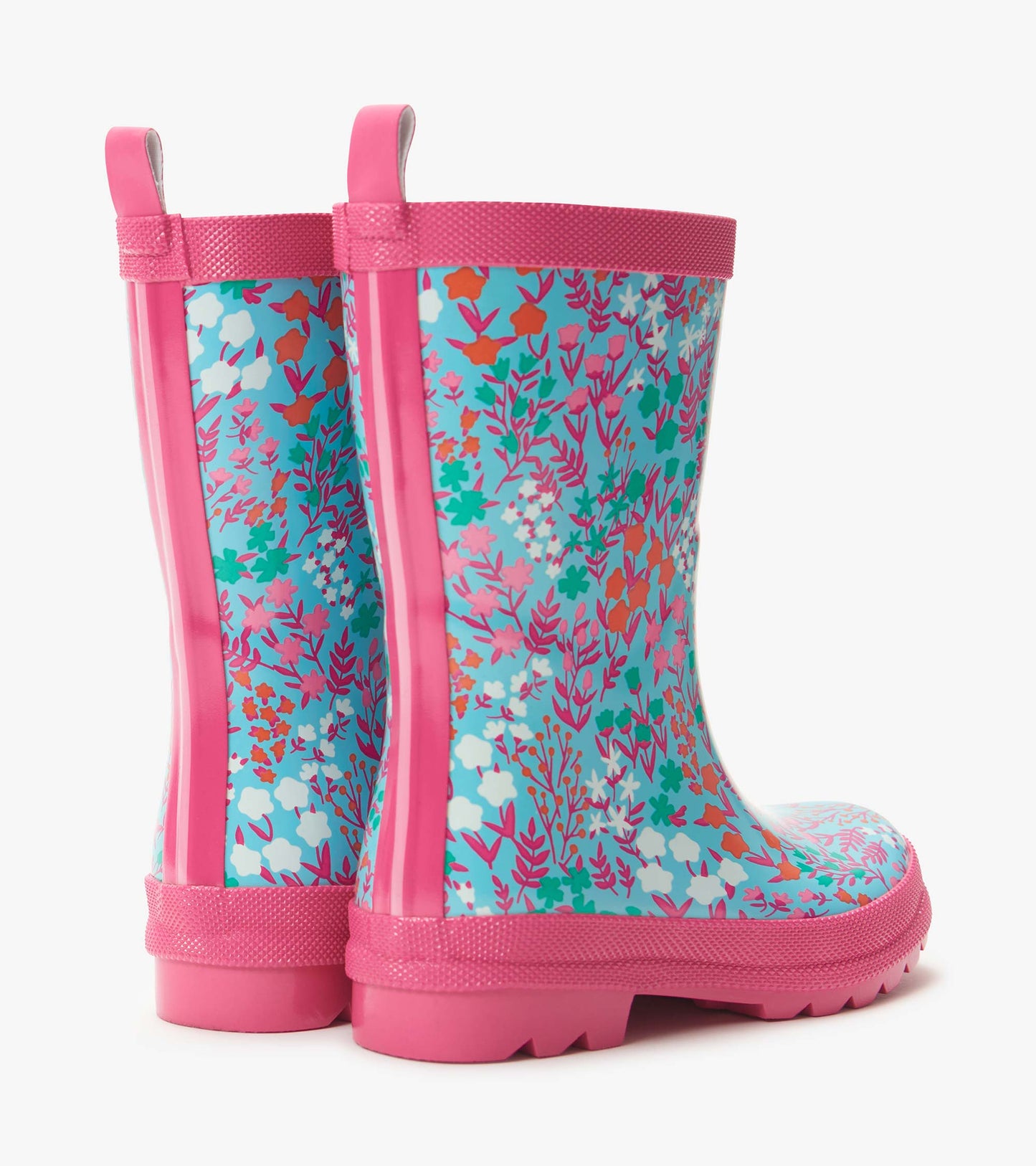 Pink kids rain boots with blue floral print and pull tabs, shown in side view