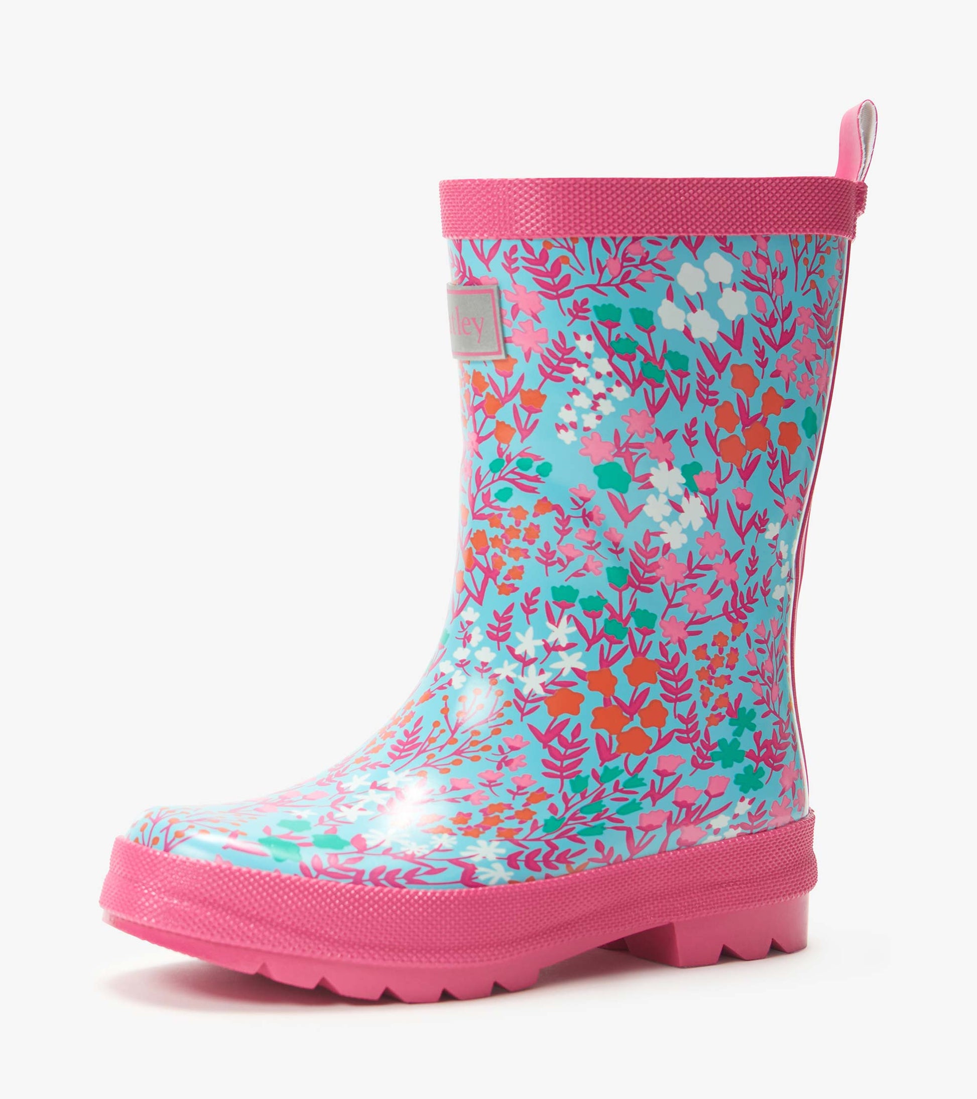 Girls turquoise floral rain boot with pink trim and sole, side view