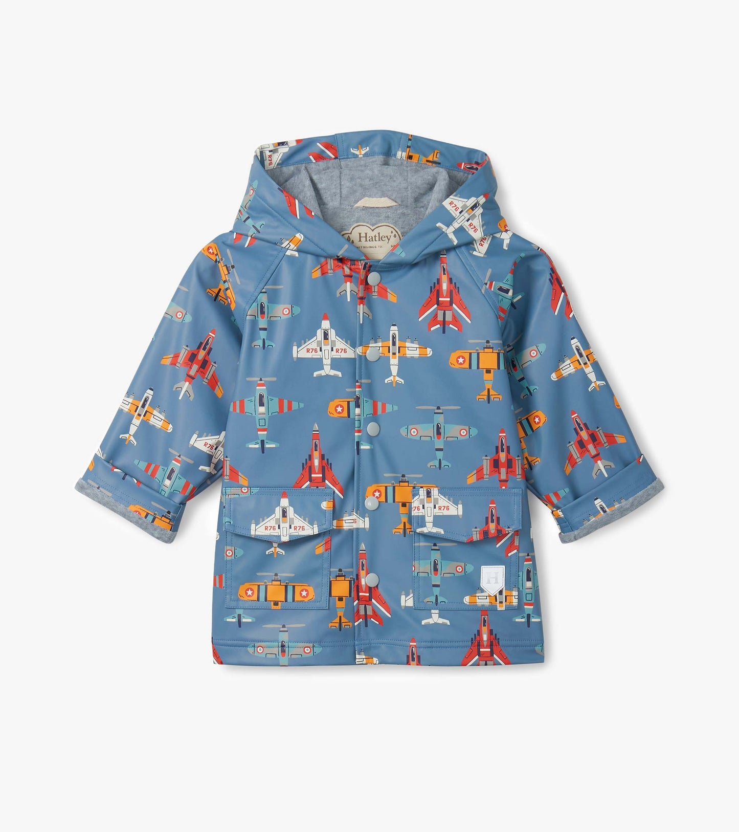 Blue hooded kids raincoat with colorful airplane print, front view, button-up with flap pockets.