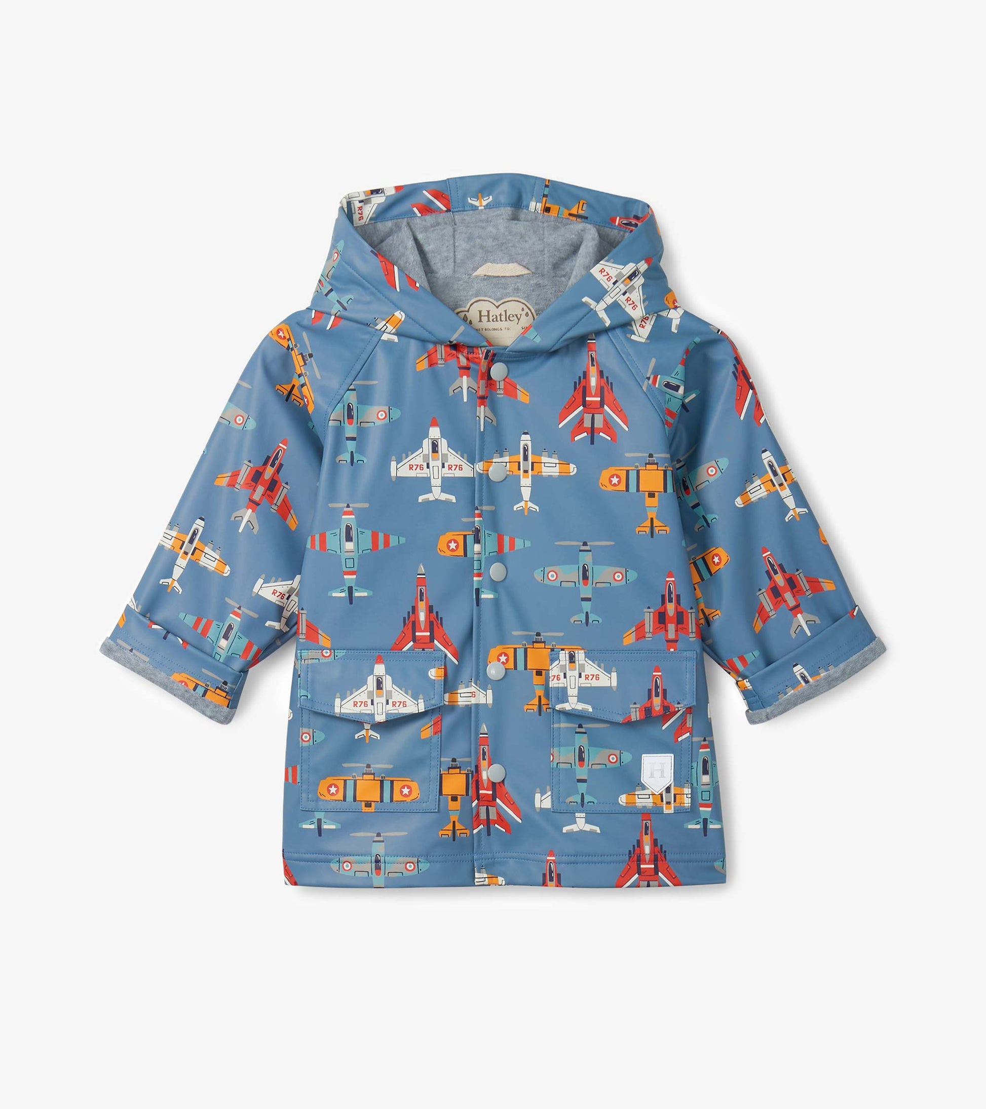 Blue hooded kids raincoat with colorful airplane print, front view, button-up with flap pockets.