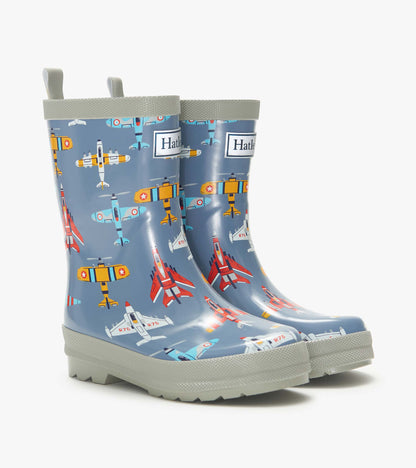 Blue kids rain boots with airplane print and gray trim, shown in side view