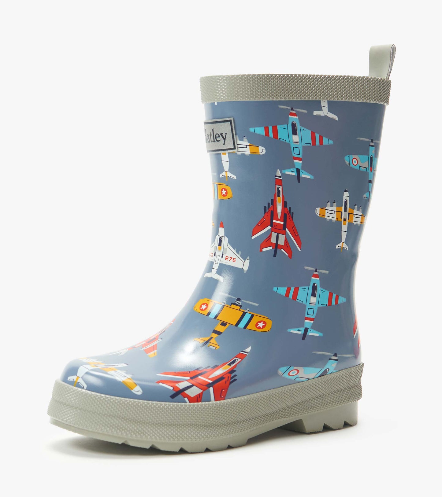 Blue kids rain boot with airplane print and gray trim, side view