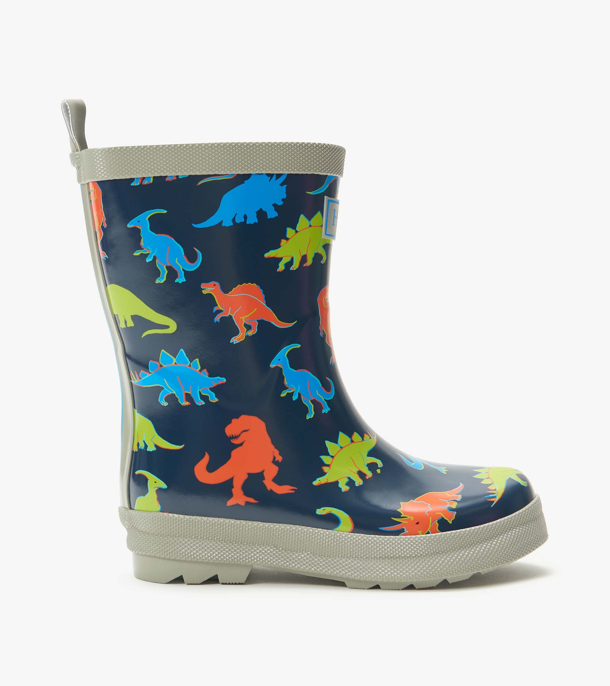 Side view of navy kids rain boot with colorful dinosaur print and gray trim and sole