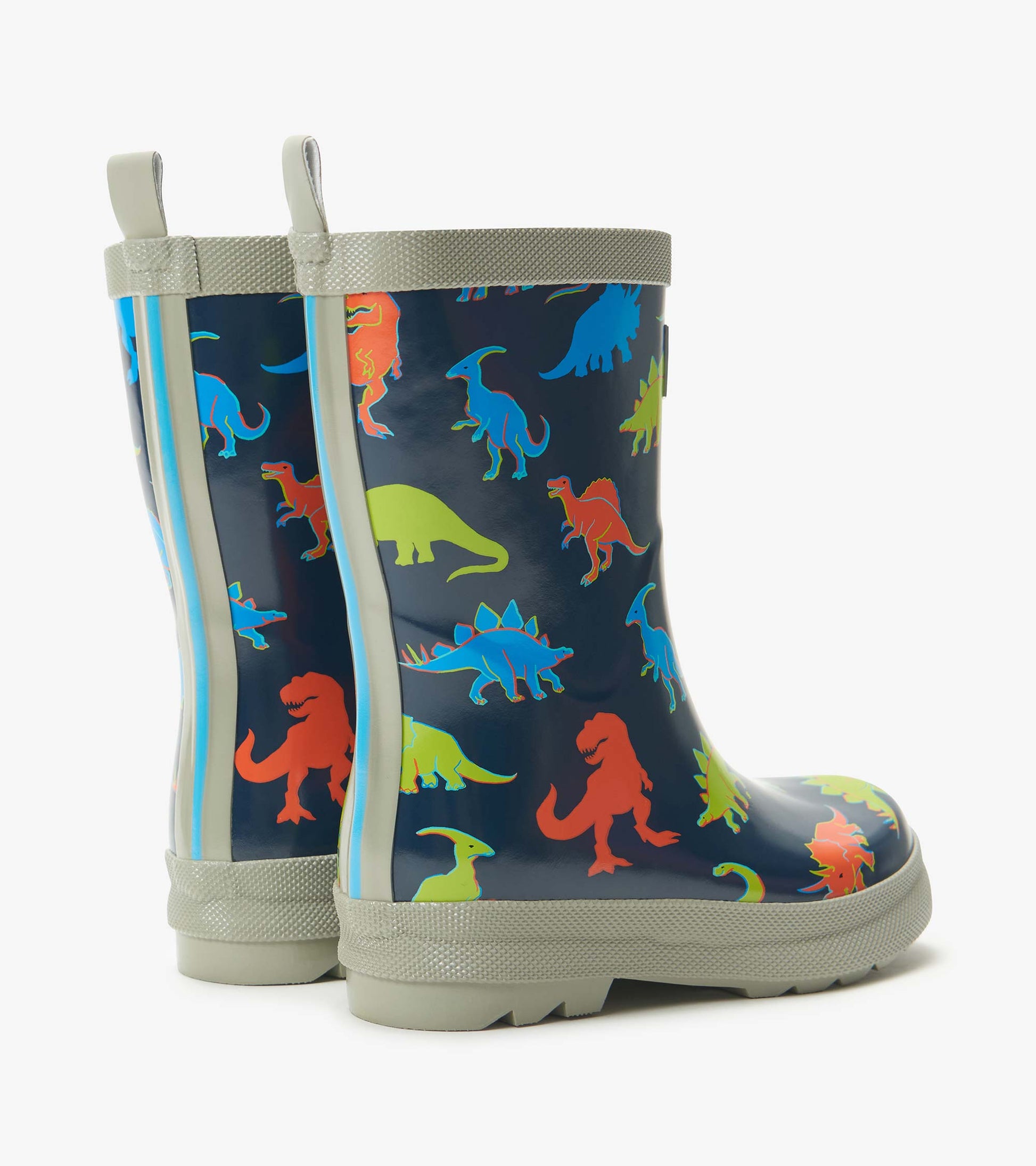 Kids navy rain boots with colorful dinosaur print and light gray trim, side view