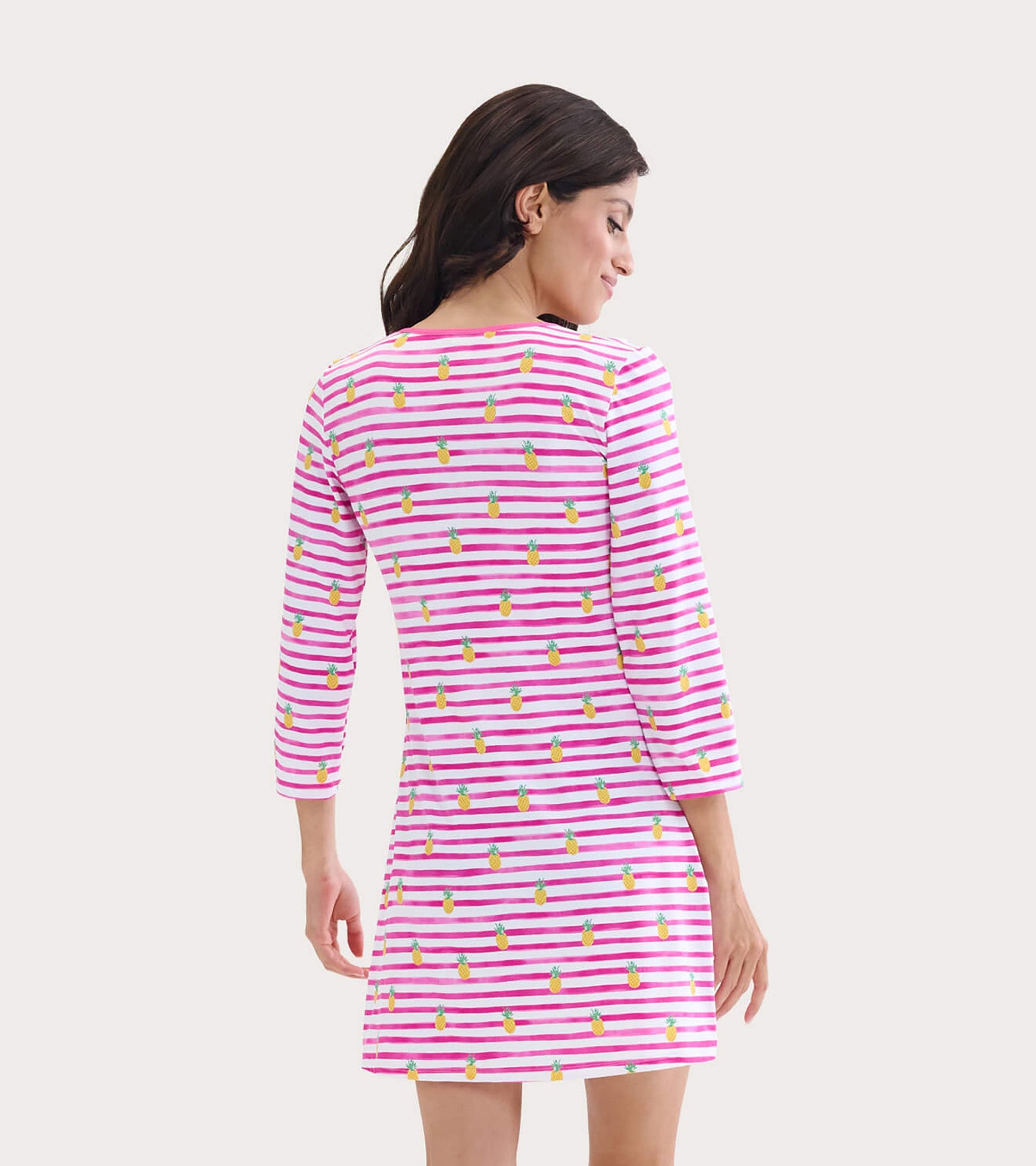 Pink and white striped beach dress with pineapple pattern, featuring three-quarter sleeves and a relaxed fit.