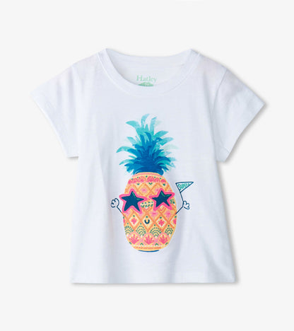 White short-sleeve tee featuring a colorful pineapple graphic with sunglasses and a party hat. Ideal for baby and toddler gi…
