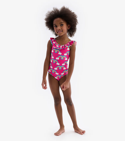 Pink swimsuit with rainbow pattern and ruffle sleeves, suitable for kids.