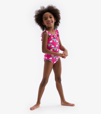 Pink swimsuit with rainbow and cloud pattern, featuring ruffle sleeves, suitable for kids.