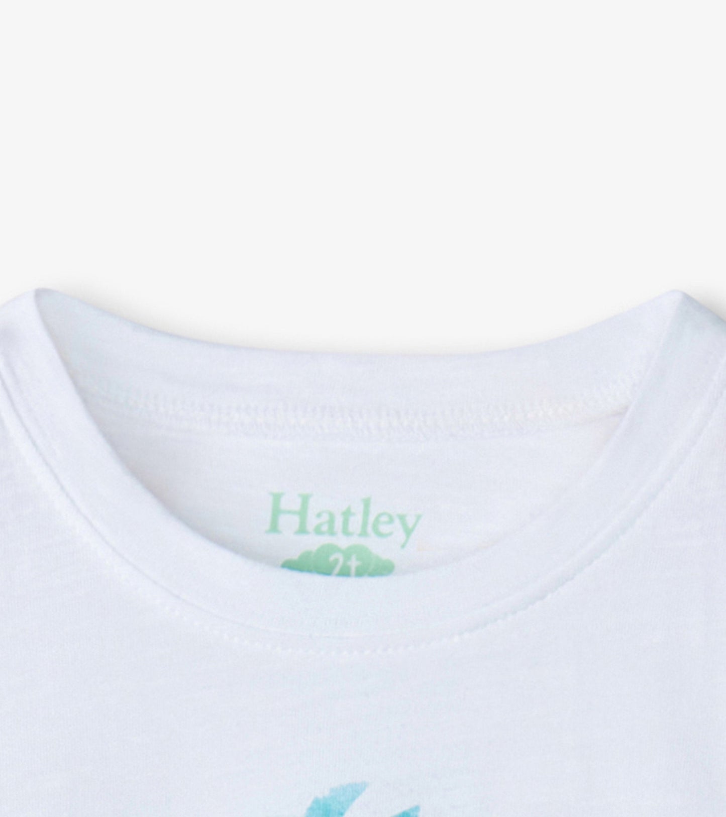 White short-sleeve tee featuring a colorful pineapple graphic on the front, suitable for baby and toddler girls.