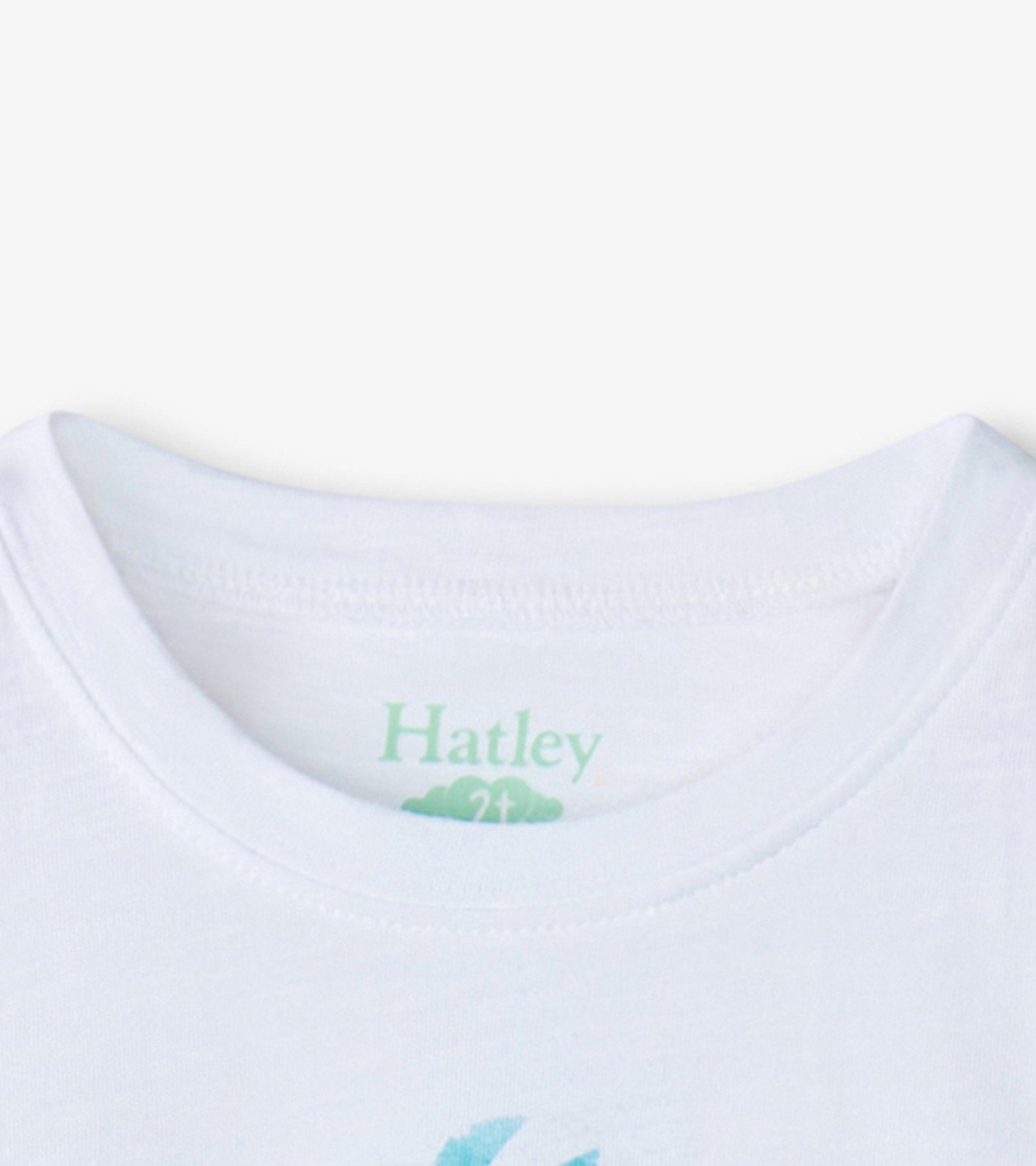 White short-sleeve tee featuring a colorful pineapple graphic on the front, suitable for baby and toddler girls.