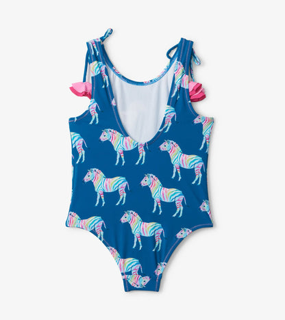 Blue swimsuit featuring colorful rainbow zebra patterns and shoulder bows. Suitable for kids, with a scoop back design.