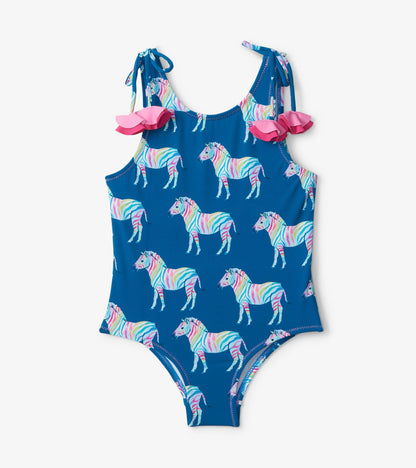 Blue swimsuit featuring colorful rainbow zebras and pink shoulder bows. Ideal for kids' swimwear.