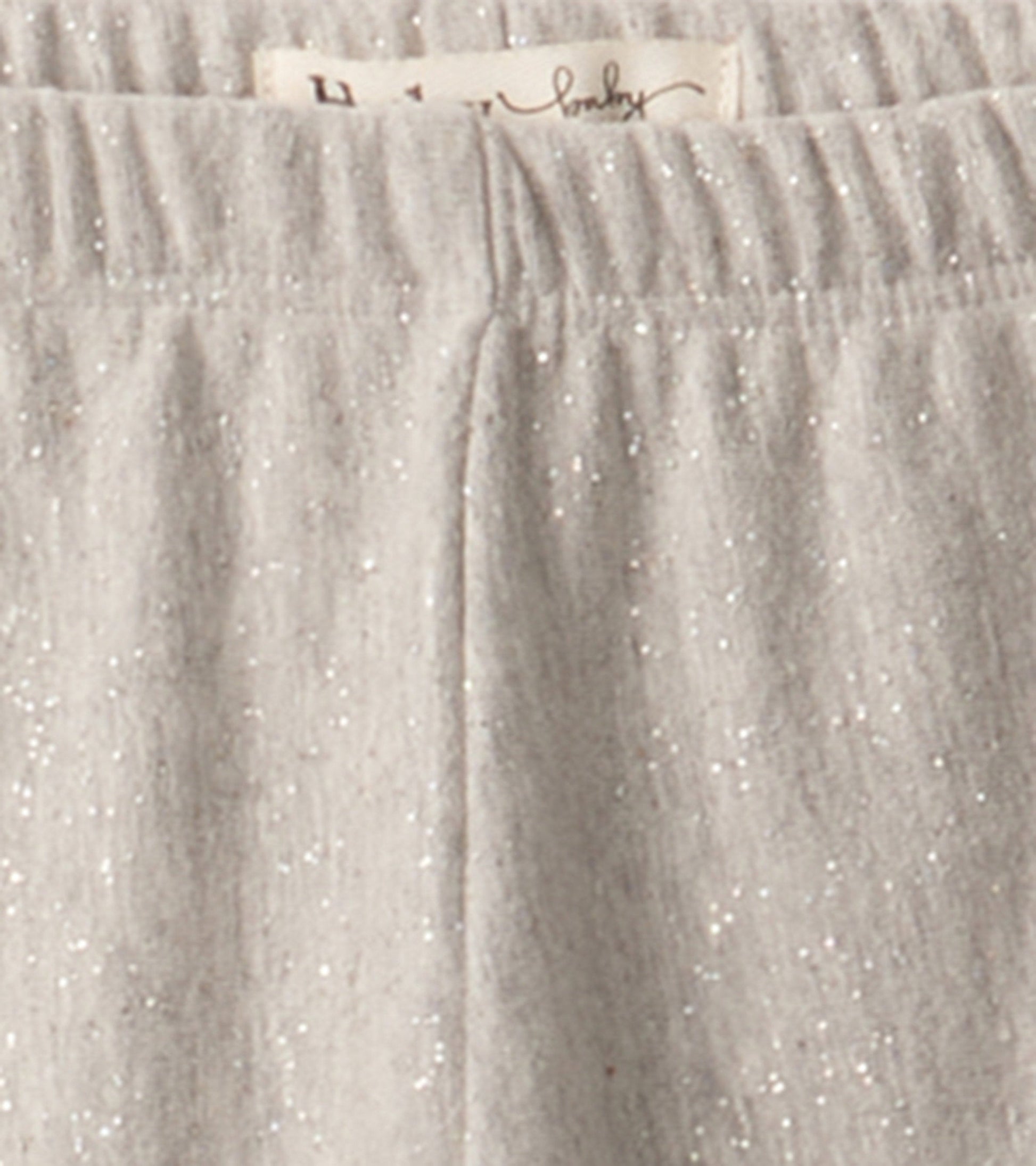 Grey melange leggings with a soft texture and subtle shimmer, featuring an elastic waistband for comfort.